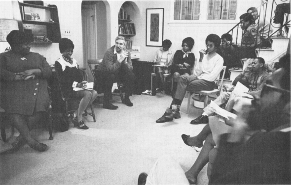 William Bunge holding a block club meeting in his home